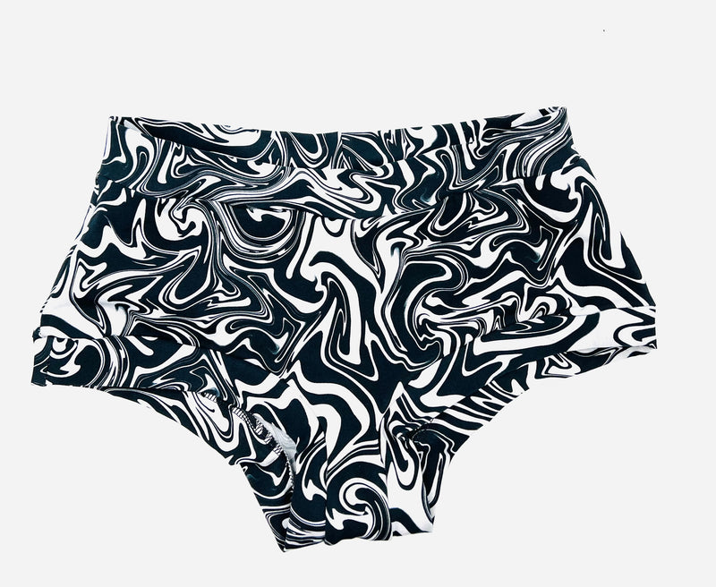 an image of full coverage pants in size large.  The colours are black and white and all swirled together.