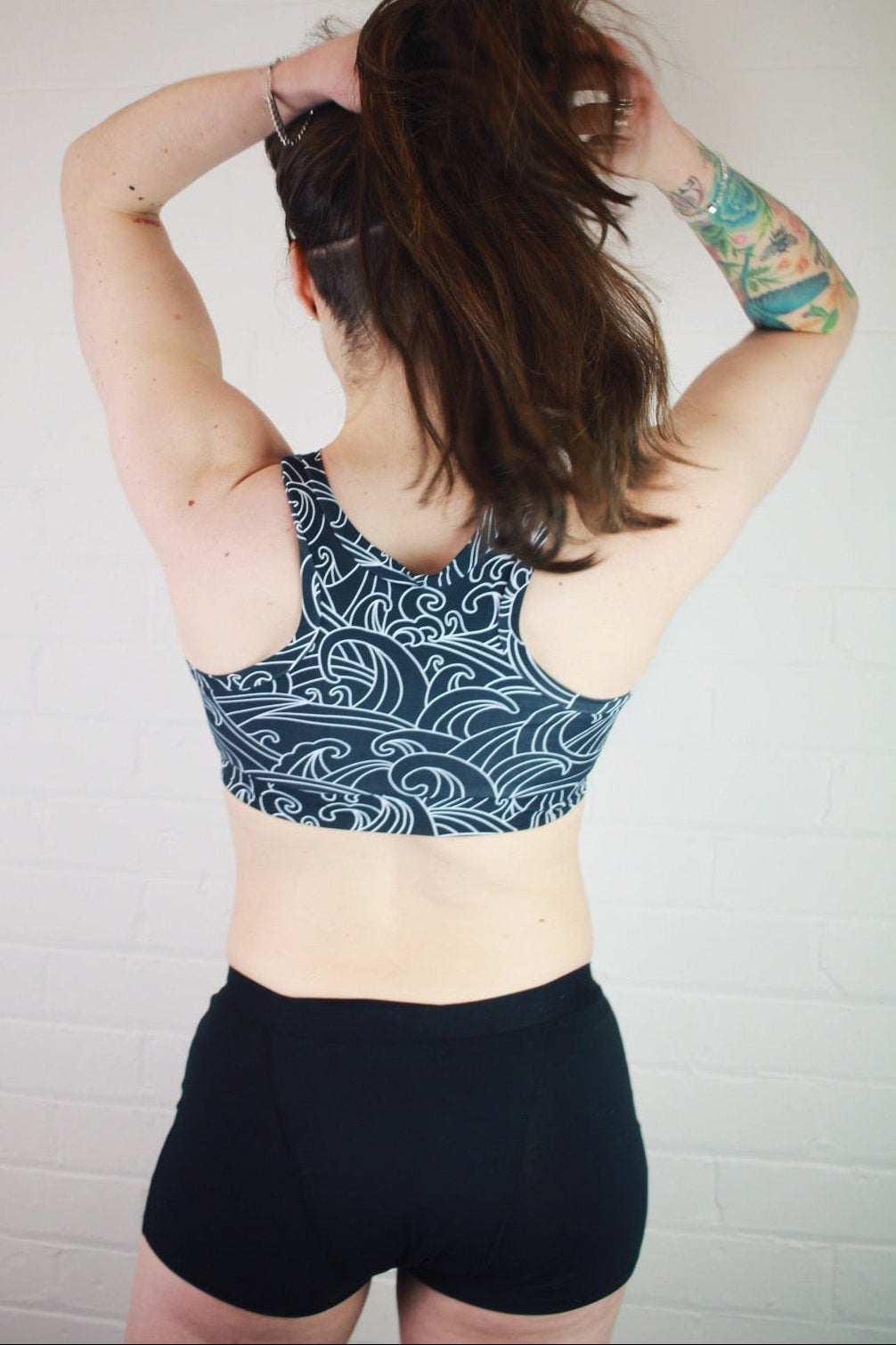 Period boxers back view wearing a racerback bralette
