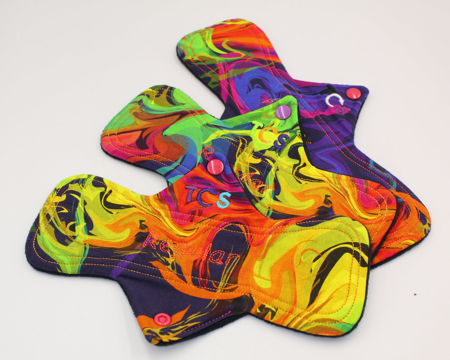 Reusable period pads with bright cotton top fabric
