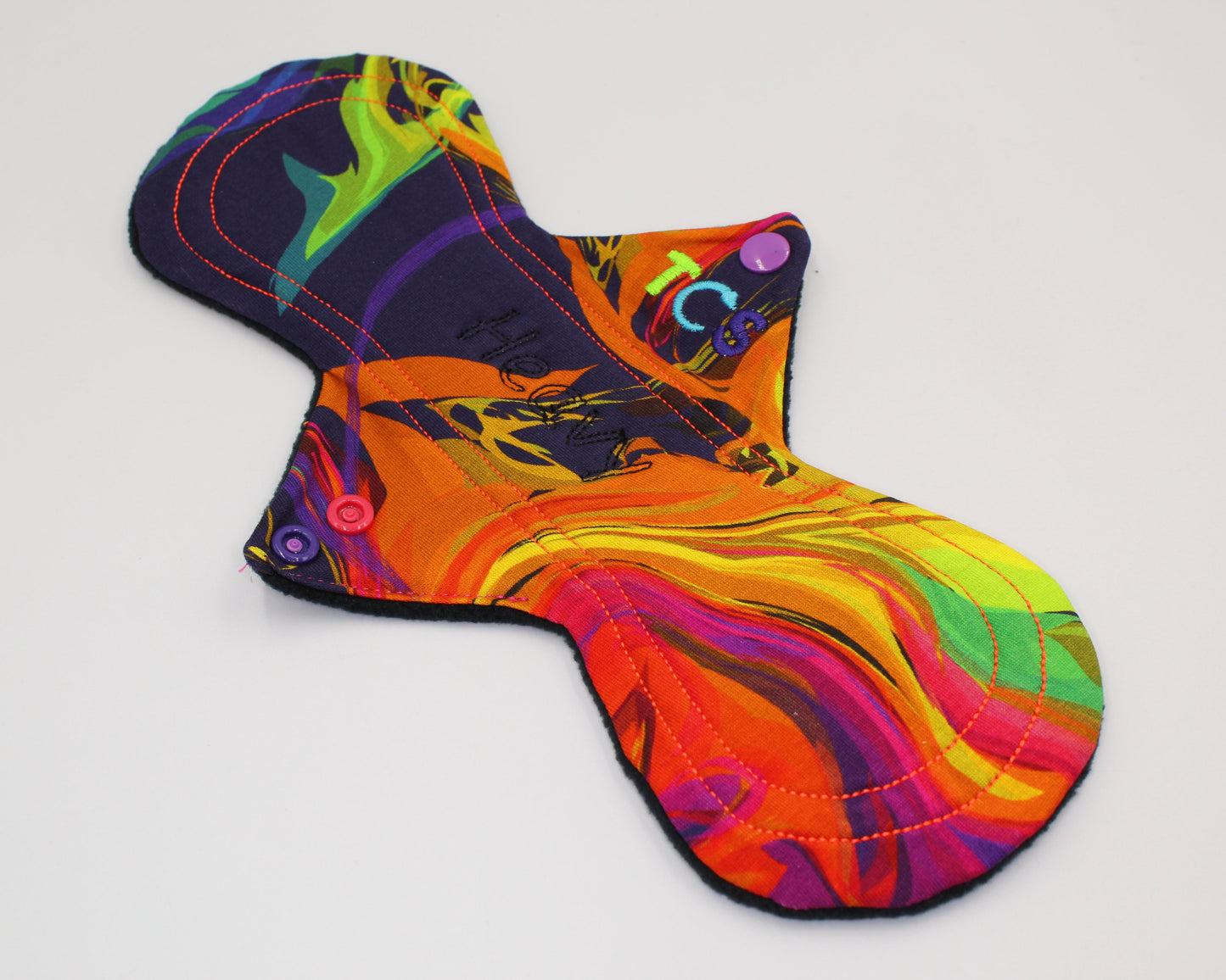 Reusable period pads with bright cotton top fabric

