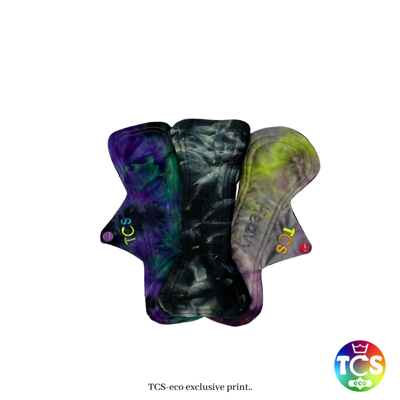 An example of a Minky Reusable Cloth Pad Starter pack from TCS-eco. The Cloth Sanitary Pads (CSP) have a brightly coloured hand dyed top fabric. The 3 pads are 10” in length and standard width, this starter pack contains 3 different TCS-eco pad shapes 3 heavy absorbency. Standard width pads are the same as a disposable.