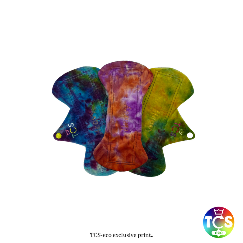 An example of a Cotton Jersey, Bamboo Velour and Minky Starter pack from TCS-eco. The Cloth Sanitary Pads have a brightly coloured hand dyed bamboo velour, Minky and a printed cotton jersey top fabric. The 3 pads are 10” in length and wide width, this starter pack contains 3 wide TCS-eco pads. Wide width shape cloth sanitary pads have a width 0.25-.05” wider than a disposable.