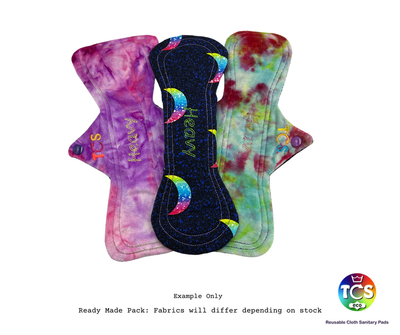 An example of a Cotton Jersey, Bamboo Velour and Minky Starter pack from TCS-eco. The Cloth Sanitary Pads have a brightly coloured hand dyed bamboo velour, Minky and a printed cotton jersey top fabric. The 3 pads are 11” in length and standard width, this starter pack contains 3 different TCS-eco pad shapes. Standard width shape cloth sanitary pads have a width the same as a disposable sanitary pad.