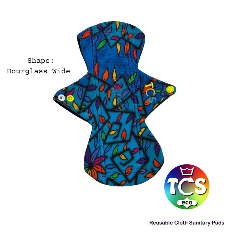 An image of an hourglass wide TCS-eco Cloth Sanitary Pad. With Stain-glass leaf cotton jersey top fabric. The TCS-eco logo and Reusable cloth Sanitary pads in writing.