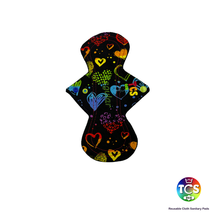 A bright vibrant cotton jersey top fabric on a hourglass shaped cloth sanitary pad.